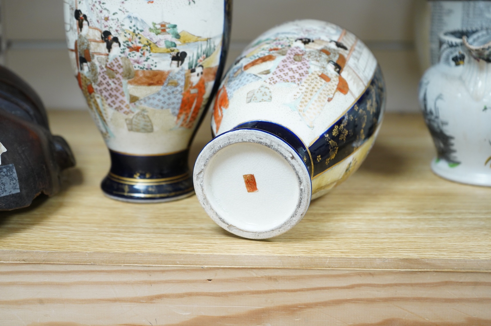 A late 19th century Chinese blue and white vase and cover and two Japanese Satsuma pottery vases, largest 24cm high